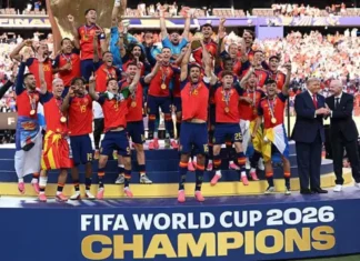 اسپانیا قهرمان جام جهانی ۲۰۲۶ شد؛ پایان باشکوه با شکست آرژانتین Soccer team on a podium celebrating as FIFA World Cup 2026 champions, wearing red jerseys with medals, surrounded by fans and a 'CHAMPIONS' banner.